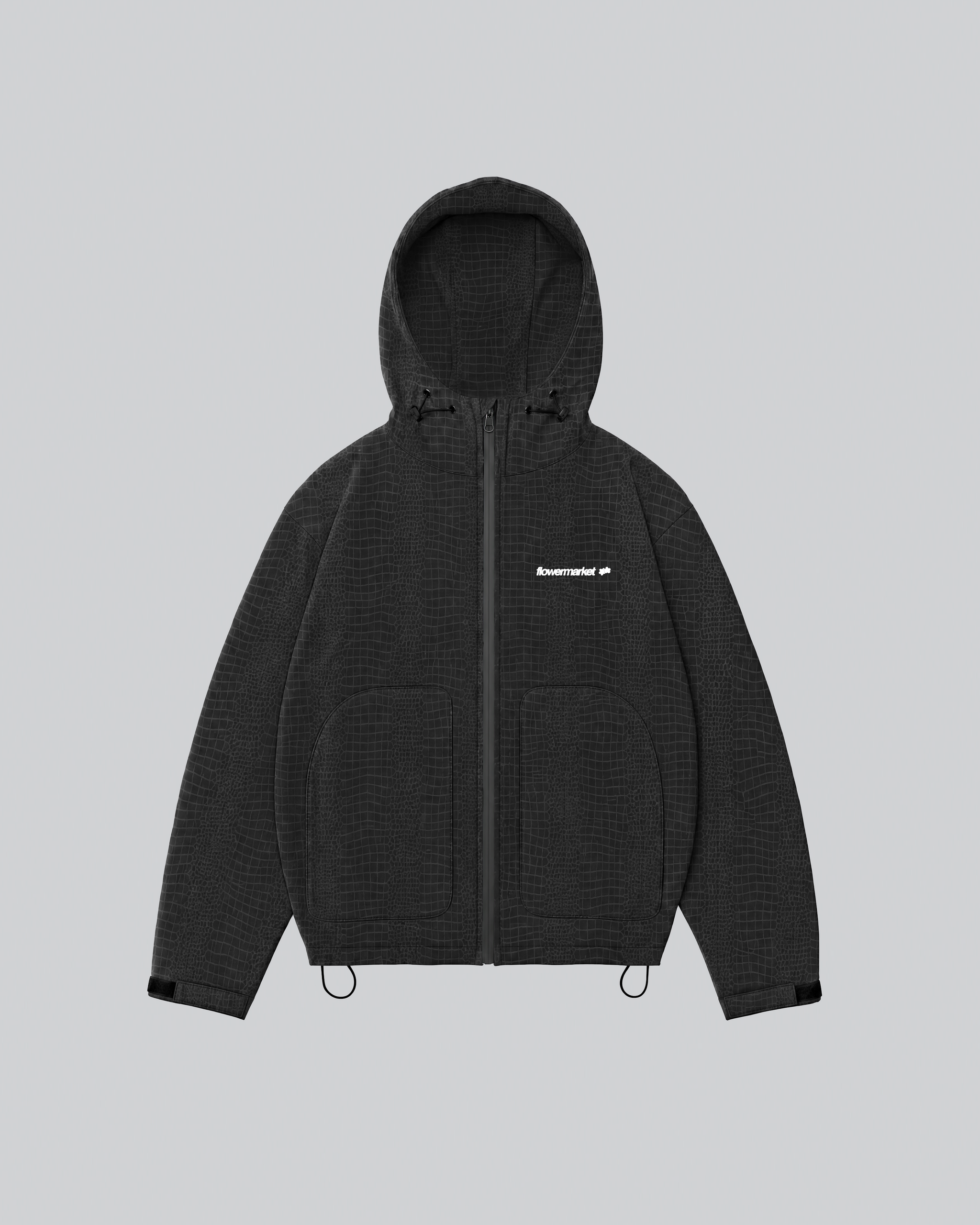 Croco Rainjacket noire mouillée : le motif croco est apparu