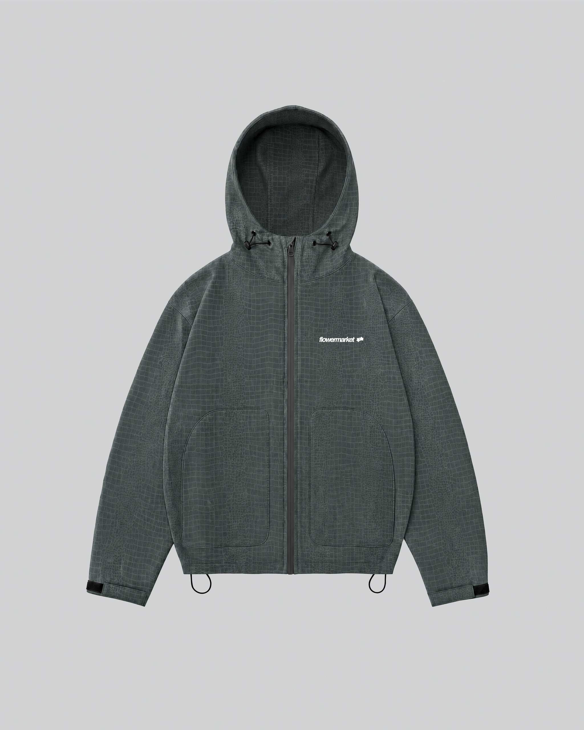 Croco Rainjacket verte mouillée : le motif croco est apparu
